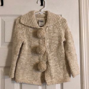 Cardi with pompoms! Very sweet.